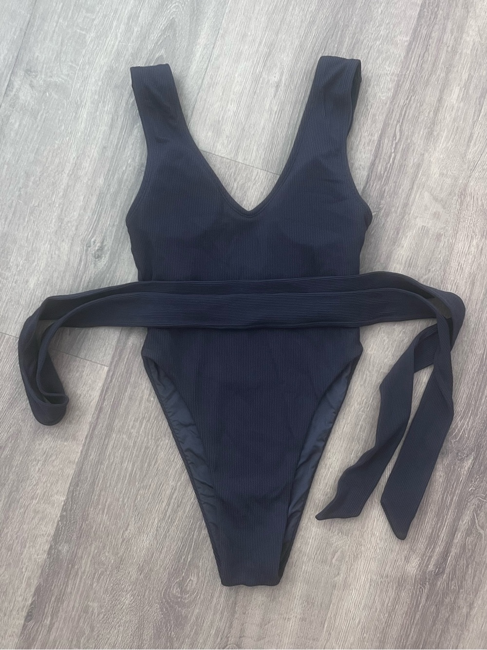 Sleek Micro-Ribbed Black V-Neck One-Piece Swimsuit with Self Tie